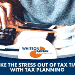 Accountant using a calculator while doing tax planning